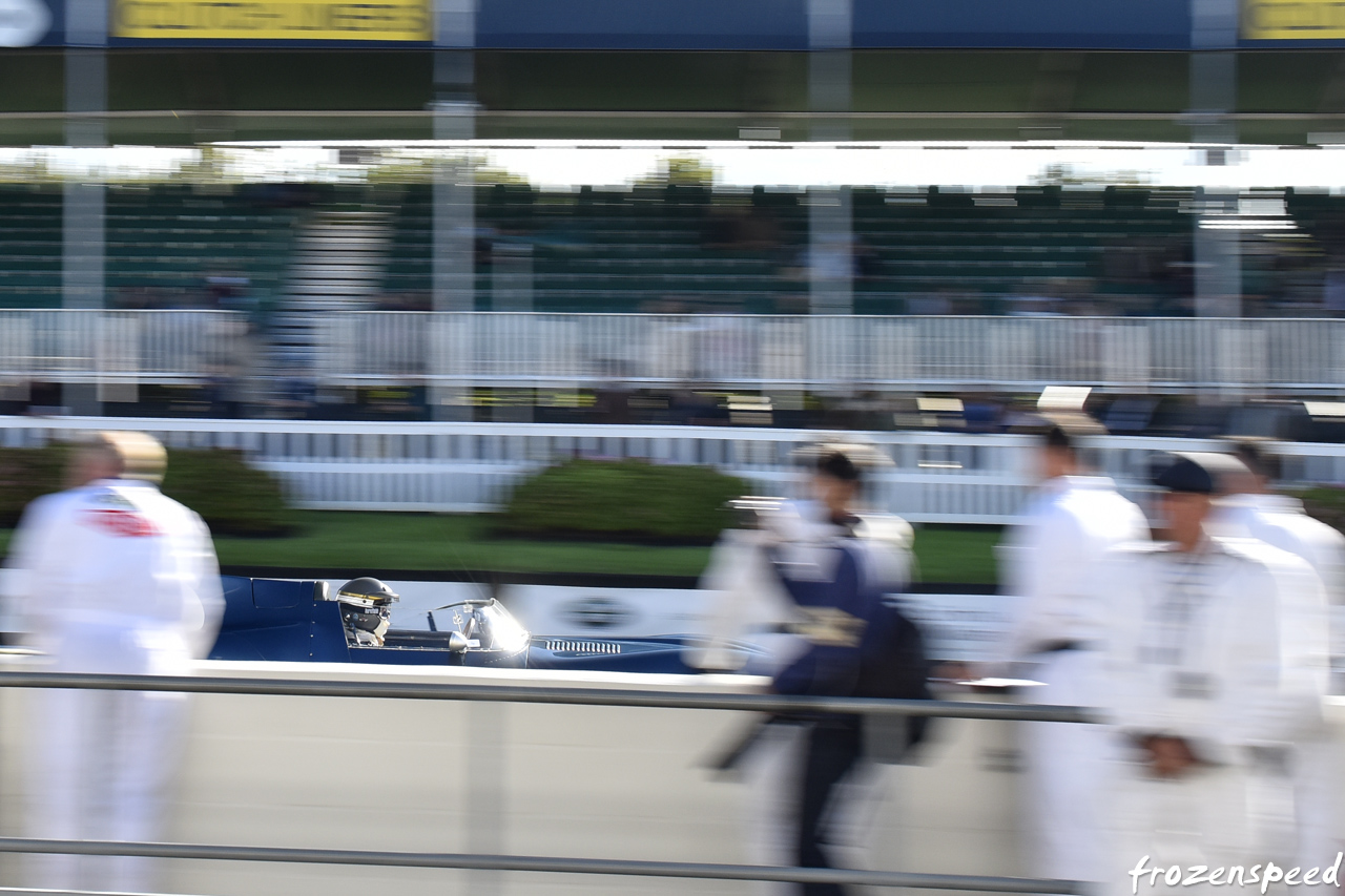 Jaguar D-type speeding past pitwall